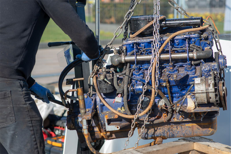 Mechanic performing an engine swap